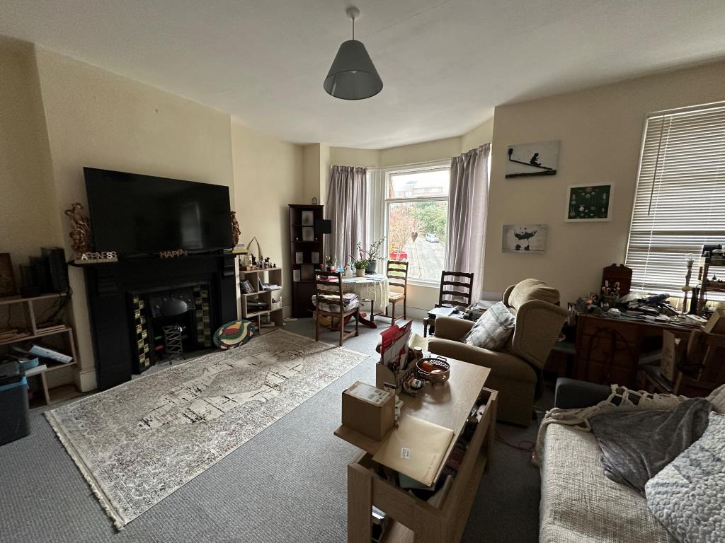 Lot: 140 - TWO-BEDROOM FLAT FOR INVESTMENT - Living room with bay window overlooking Nelson Road